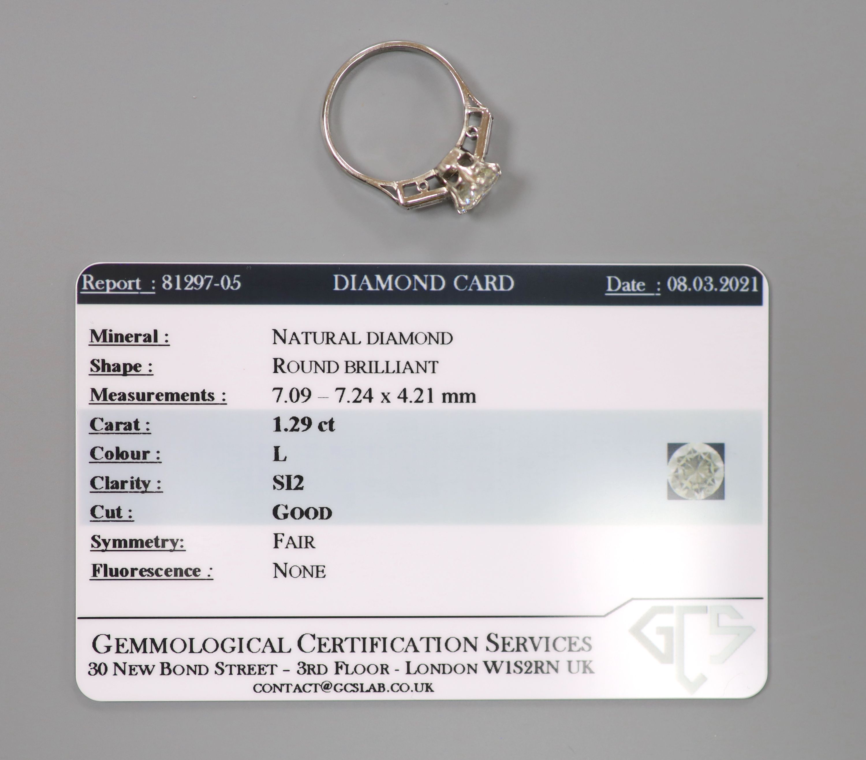 A modern platinum and single stone diamond ring,